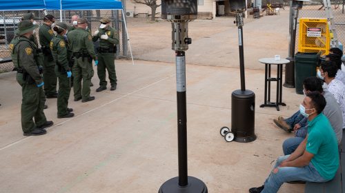 U.S. Customs and Border Protection operations following the implementation of Title 42 USC 265 at the northern and southern land borders. U.S. Border Patrol agents use personal protective equipment as they prepare to process a group of individuals encountered near Sasabe, Ariz. on March 22, 2020. CBP Photo by Jerry Glaser
