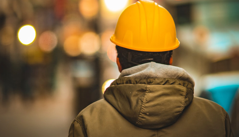 man in yellow hardhat and work jacket