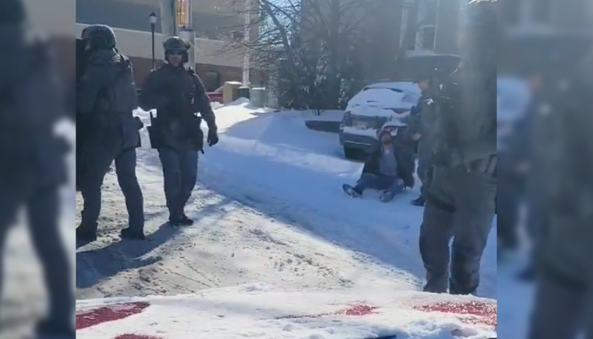 police officers standing outside in the snow